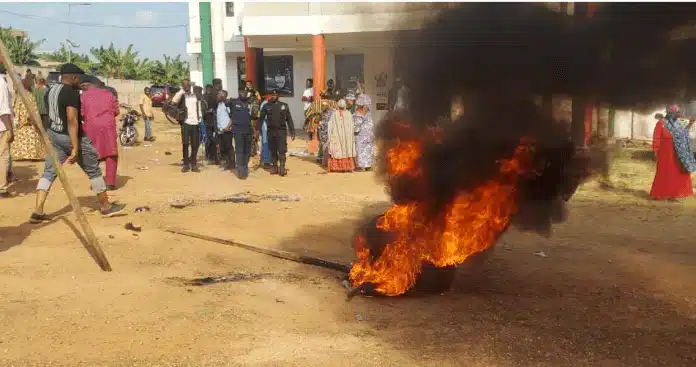 Angry Asawase constituents storm party office, burn car tyres to protest removal of Muntaka