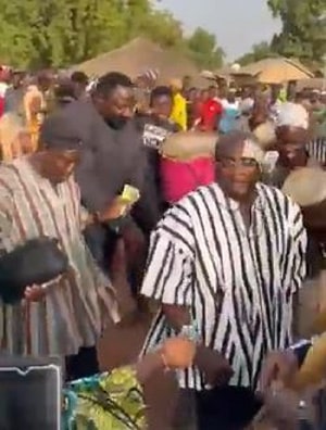 Bawumia performs his dance moves as others throw money at him