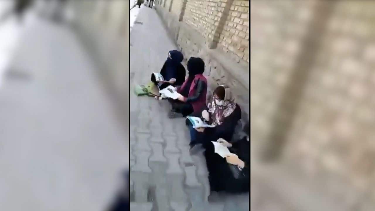 Afghan women demonstrate outside Kabul University over return of male students to class