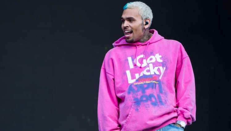 Chris Brown throws fan’s phone into the crowd for filming while on stage