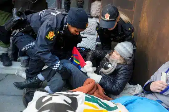 Police detain and transport Greta Thunberg