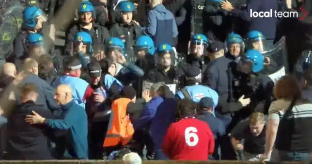 Fans fight police in the stadium prior to Italy vs. England,