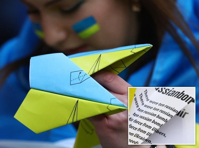 Ukrainian supporters parody Putin’s military at football game with paper planes