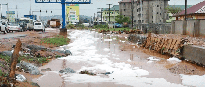 Waste water turns foamy as it flows on Accra-Kasoa highway