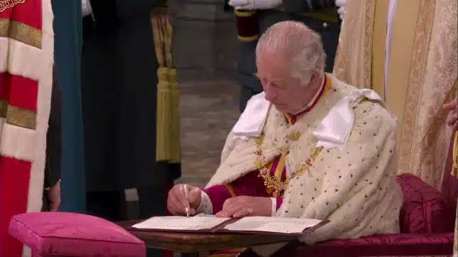 Charles appears relieved as pen continues to work on his big day