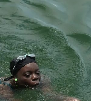Ghanaian activist swims 450km across Volta Lake to highlight textile pollution