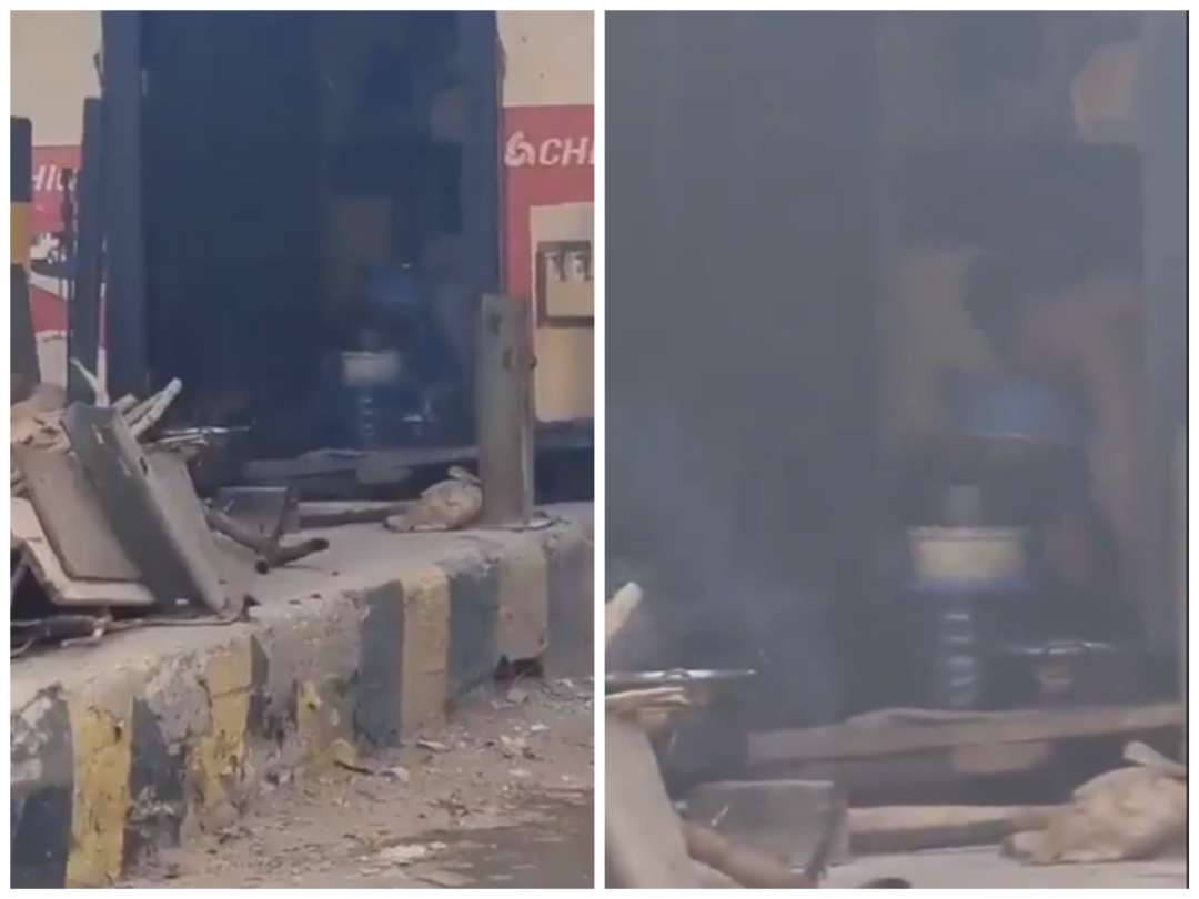 Ghanaian spotted cooking in toll booth on Tema Motorway road