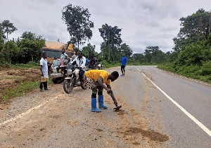 Road minister arrests, compels illegal miners to clean mud off road