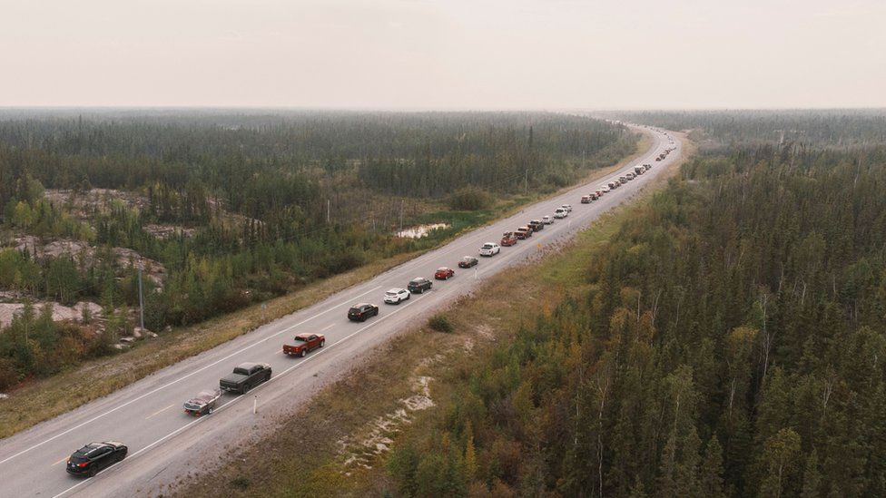 Yellowknife fires: Evacuees swarm air and road networks prior to deadline at noon