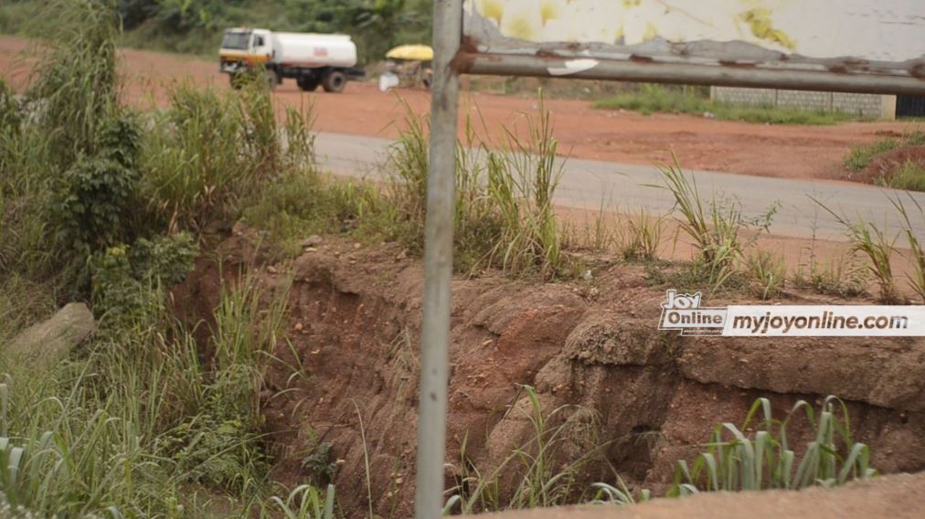 Gullies caused by abandoned road project pose danger to Dominase residents