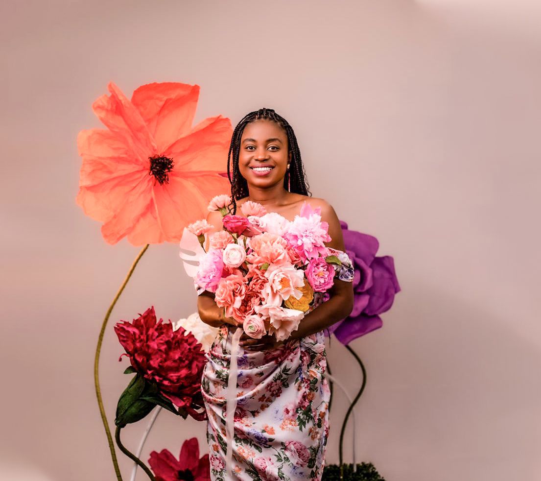 Zimbabwean florist, demonstrates how she uses paper flowers to bring nature to life
