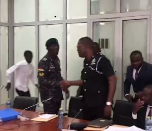 IGP spotted exchanging pleasantries with  Supt George Asare