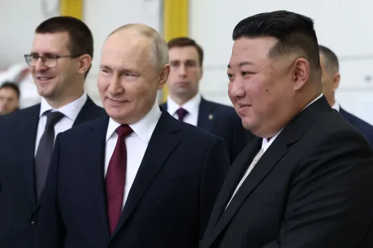 Kim and Putin hold hands as Kim sarcastically hails ‘sacred war’