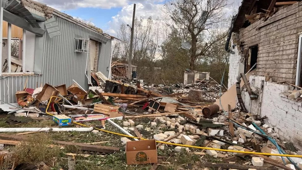 Ground soiled with blood after horrific village attack in Ukraine