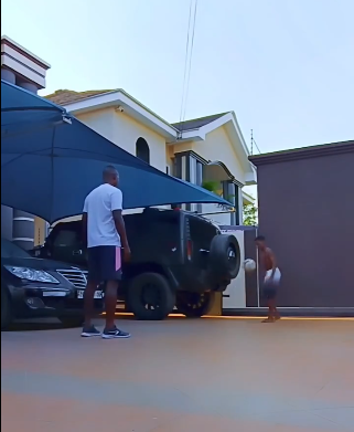 Video: John Paintsil and son flaunt football skills at home
