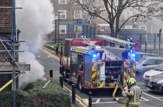 Woman dies in massive apartment tower fire in London