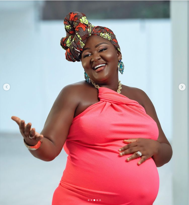 AJ Poundz shows baby bump