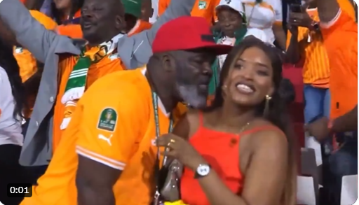 Ivorian football fan apologizes to wife after making pass at another woman during AFCON tournament