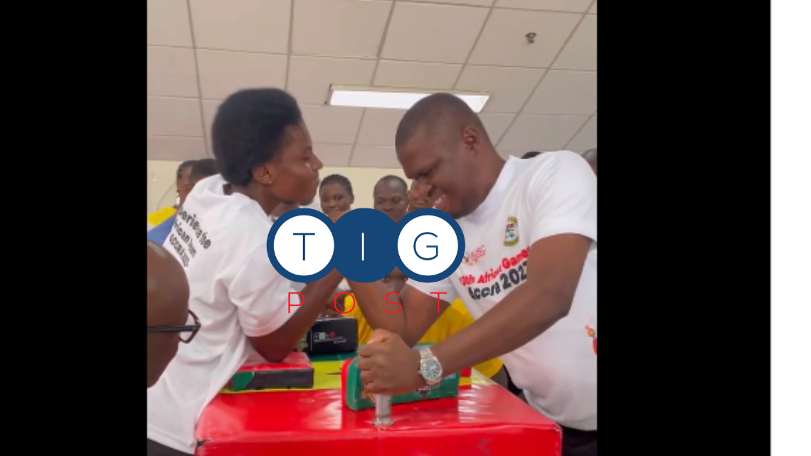 ‘Proud’ Sports Minister engages in armwrestling contest with a lady