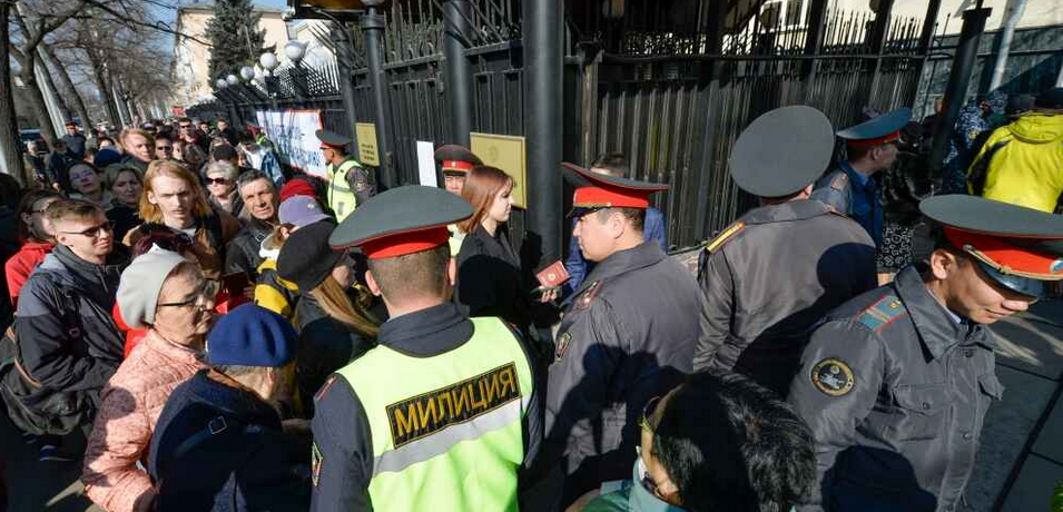 Putin celebrates his unassailable election win as Russians silently demonstrate