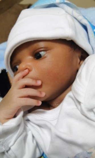 Video: Newborn baby boy’s reaction after birth causes stir online; “what is he thinking about?”