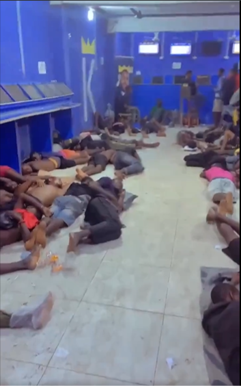Video: Group of individuals sleep in a bet shop in Nigeria as they await bet results