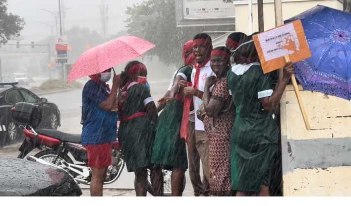 Newly graduated nurses and midwives protest in rain to demand posting