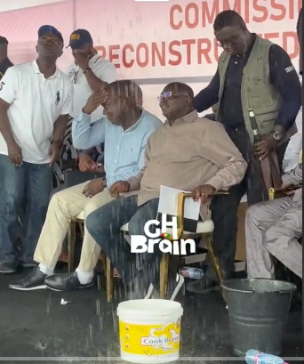 Buckets hold rainwater that nearly destroyed comissioning of reconstructed Appiatse community