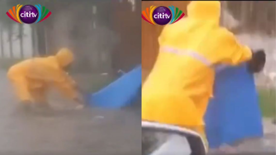 Woman caught disposing rubbish on a flooded street in Tesano