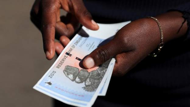 Zimbabwe urges quick adoption of new currency despite scarcity