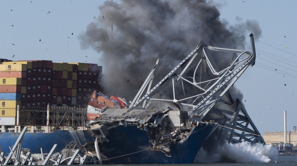 Collapsed Baltimore bridge span falls after workers detonate series of explosives