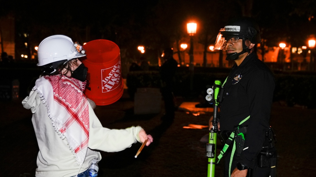 Anti-war demonstrators depart University of Southern California after arrival of the police