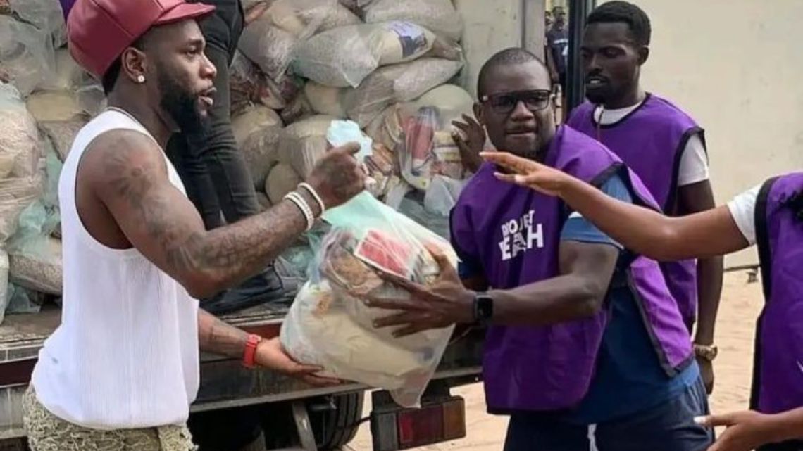 Burna Boy shares food items, foots medical bills for the needy