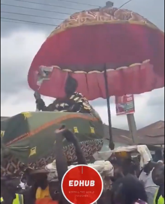Chief waves NDC flag during Akwanbo festival procession
