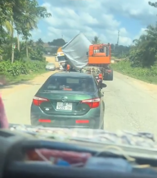 Driver feared dead after heavy load under escort fell onto truck at Abura Dunkwa