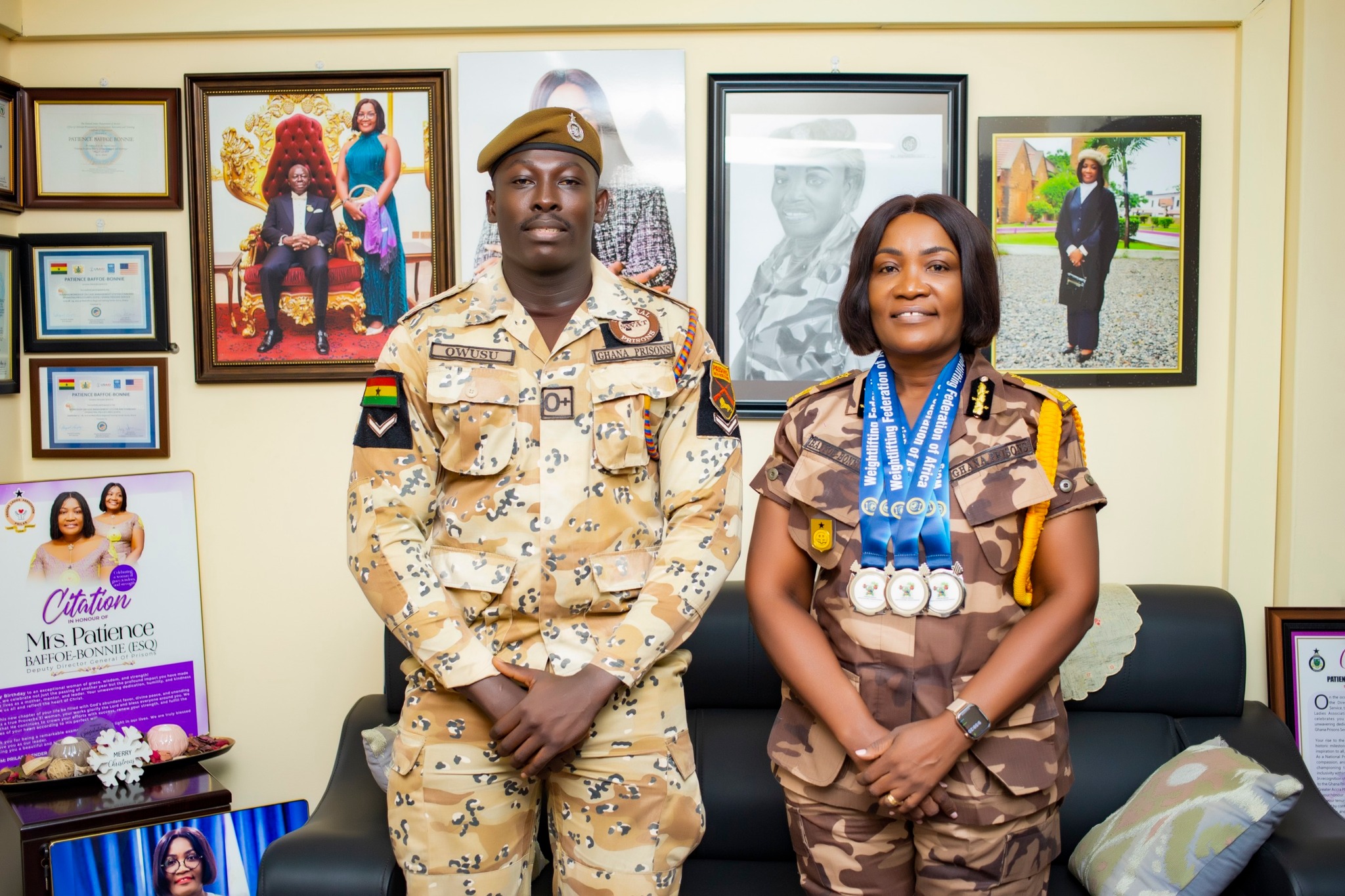Prison Officer presents 3 silver medals won during African Senior Weightlifting Championship to leadership