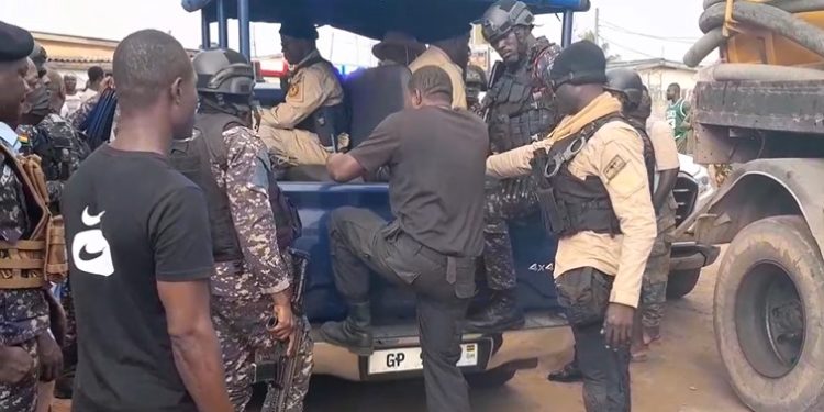 Police arrest individuals in security uniform at Ablekuma North polling station